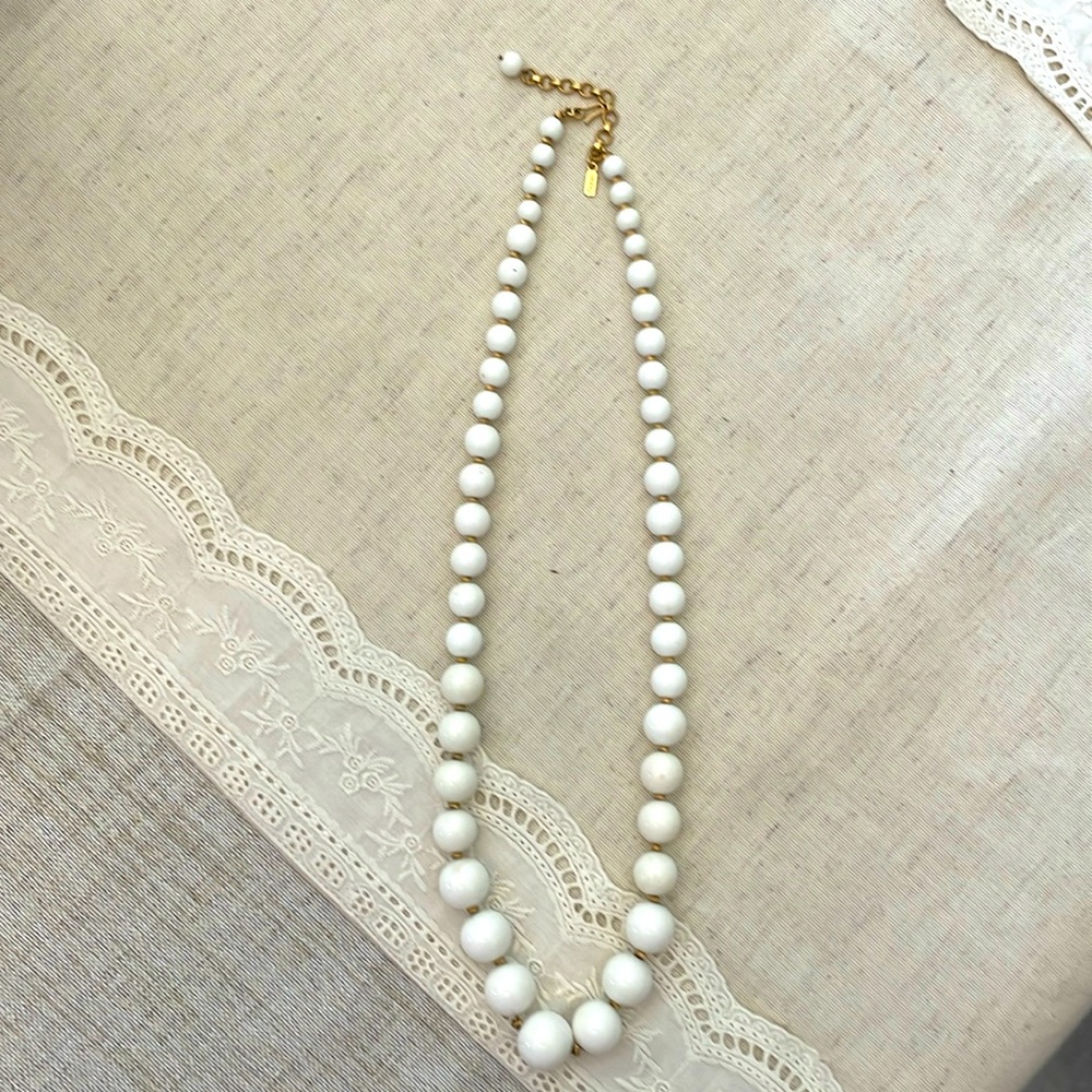 Monet Necklace, graduated white beads and gold color spacers.